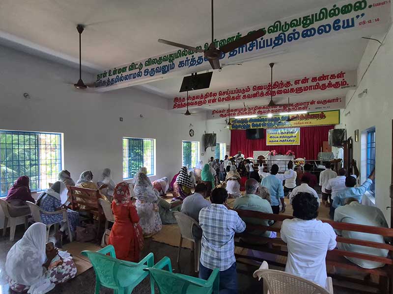 Church family praying together